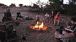 03-The kids get ready for dinner around the campfire at Coburns Pines